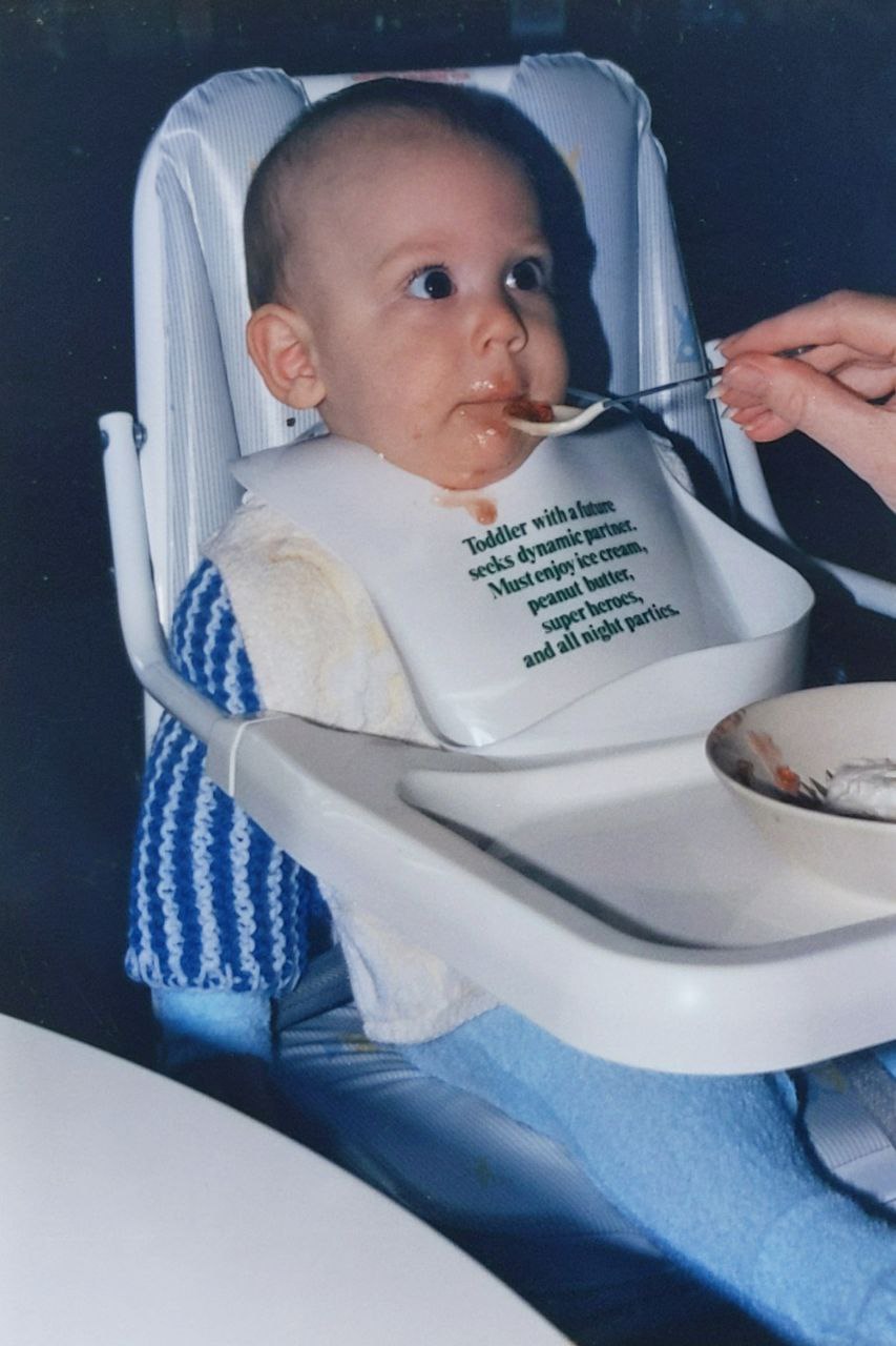 Baby David eating in his high chair