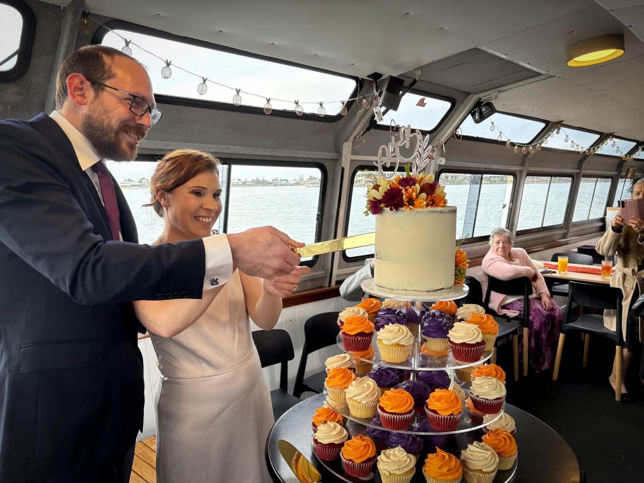 Bree and David cutting cake at the engagement party